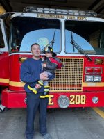 Billy being held by Bry IFO Philly FD E-208 Spare E-12.jpg