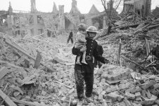 London fireman-carries-a-young-boy-out-of-the-rubble-after-a-bombing-raid.jpg